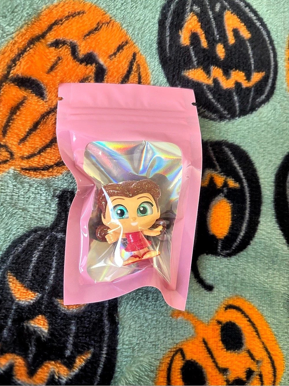 Rosetta figure from Disney Doorables Series 8 inside a pink pouch.